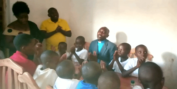 Pastor singing with children